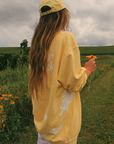 Get Your Pink Back Feather Line Yellow Crewneck