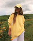 Get Your Pink Back Feather Line Yellow Crewneck
