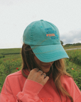 Get Your Pink Back Feather Line Green Dad Hat