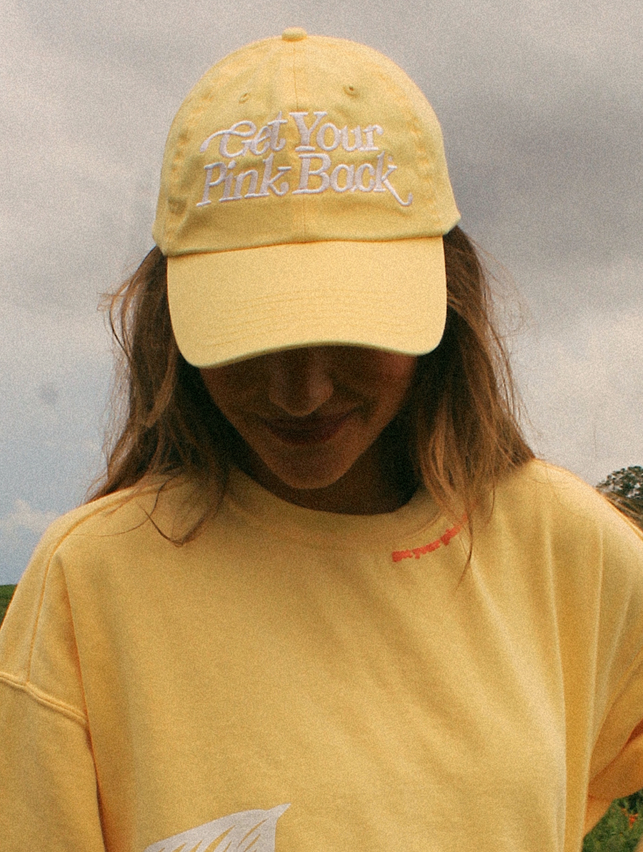 Get Your Pink Back Feather Line Yellow Dad Hat